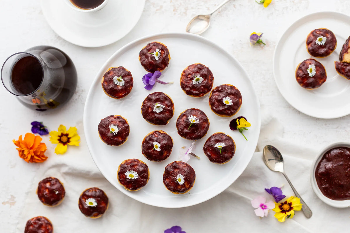 Mini MannaBrew Cheesecakes with Raspberry Glaze